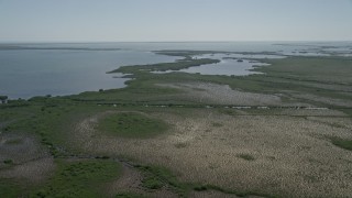 AX0025_029 - 5K aerial stock footage of approaching shore of Little Card Sound, Homestead, Florida