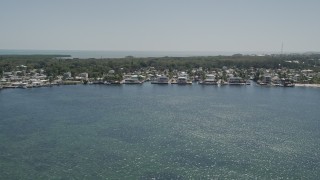 5K aerial stock footage of flying by homes on the shore of Blackwater Sound, Key Largo, Florida Aerial Stock Footage | AX0025_064