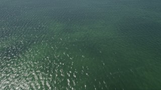 AX0025_069 - 5K aerial stock footage of flying over shallow water of Buttonwood Sound, Key Largo, Florida