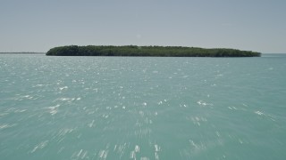 5K aerial stock footage of flying over water, tilt up to reveal mangroves near shore, Tavernier, Florida Aerial Stock Footage | AX0025_079E