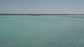 5K aerial stock footage of flying over clear water off the shore, Tavernier, Florida Aerial Stock Footage | AX0025_082