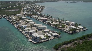 5K aerial stock footage video of flying over homes on the shore, Tavernier, Florida Aerial Stock Footage | AX0025_086