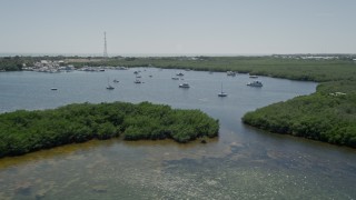 5K aerial stock footage of flying by sailboats and fishing boats off the shore, Tavernier, Florida Aerial Stock Footage | AX0025_088E