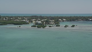 5K aerial stock footage of approaching homes on the shore, Tavernier, Florida Aerial Stock Footage | AX0025_099