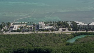 5K aerial stock footage of flying by Breezy Palms Resort, Hampton Inn and Suites, Islamorada, Florida Aerial Stock Footage | AX0025_118