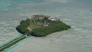 AX0025_119 - 5K aerial stock footage of flying by a home on Tea Table Key, Islamorada, Florida