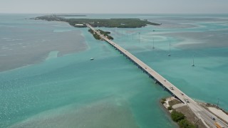 AX0025_120E - 5K aerial stock footage follow Overseas Highway, approach Lower Matecumbe Key, Islamorada, Florida