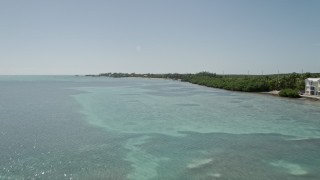 5K aerial stock footage of flying over the Atlantic Ocean near the coast, Islamorada, Florida Aerial Stock Footage | AX0025_124