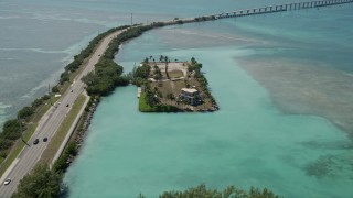 5K aerial stock footage of approaching an oceanfront home on Craig Key, Florida Aerial Stock Footage | AX0025_134