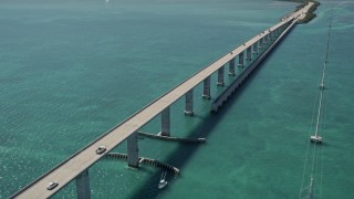 AX0025_135E - 5K aerial stock footage of approaching Overseas Highway bridge to Fiesta Key, Florida