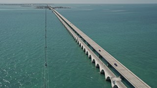 AX0025_145E - 5K aerial stock footage of following Overseas Highway to Conch Key, Marathon, Florida