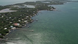 5K aerial stock footage fly by homes on shore of Grassy Key, Marathon, Florida Aerial Stock Footage | AX0025_155