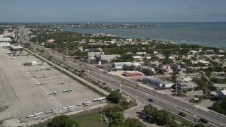 5K aerial stock footage fly by Overseas Highway, Florida Keys Marathon Airport, Marathon, Florida Aerial Stock Footage | AX0026_002