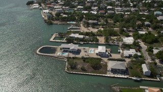 5K aerial stock footage of flying over oceanfront homes in Marathon, Florida Aerial Stock Footage | AX0026_005