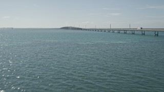 5K aerial stock footage of flying by light traffic on the Seven Mile Bridge, Florida Aerial Stock Footage | AX0026_021E