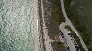 5K aerial stock footage of bird's eye view of people on the beach, Bahai Honda Key, Florida Aerial Stock Footage | AX0026_036