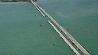 AX0026_054E - 5K aerial stock footage follow Overseas Highway over Ramrod Key, approach Summerland Key, Florida