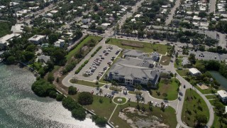 5K aerial stock footage of approaching Key West VA Outpatient Clinic, Key West, Florida Aerial Stock Footage | AX0026_060