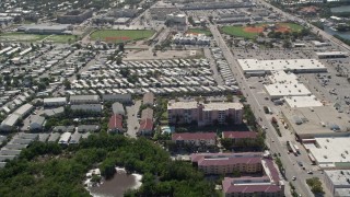 5K aerial stock footage of tilting down to apartment buildings, Key West, Florida Aerial Stock Footage | AX0026_062