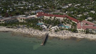 AX0027_008 - 5K aerial stock footage of flying by the Casa Marina, Key West, Florida