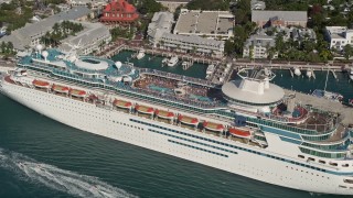 5K aerial stock footage of flying by a Royal Caribbean cruise ship docked, Key West, Florida Aerial Stock Footage | AX0027_014