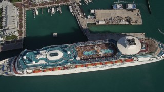 5K aerial stock footage of approaching Royal Caribbean Cruise Ship docked, tilt down, Key West, Florida Aerial Stock Footage | AX0027_018