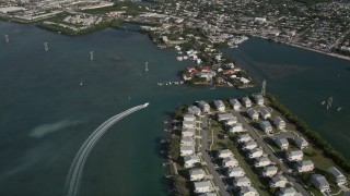 AX0027_025 - 5K aerial stock footage of tracking a fishing boat as it passes end of Trumbo Point, Key West, Florida