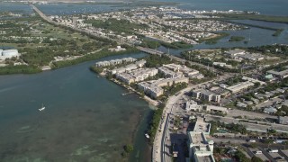 AX0027_030 - 5K aerial stock footage of following coast toward Stock Island, Key West, Florida