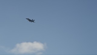 AX0027_034 - 5K aerial stock footage of tracking an F-18 in flight, Naval Air Station Key West, Key West, Florida