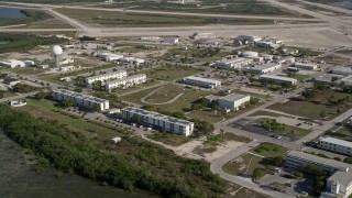 AX0027_038 - 5K aerial stock footage of flying by Naval Air Station Key West, Key West, Florida