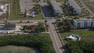 5K aerial stock footage of flying by military jets on display, Naval Air Station Key West, Key West, Florida Aerial Stock Footage | AX0027_039