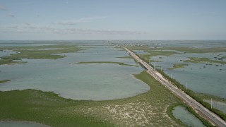 5K aerial stock footage of following Overseas Highway, Saddlebunch Keys, Florida Aerial Stock Footage | AX0027_045E