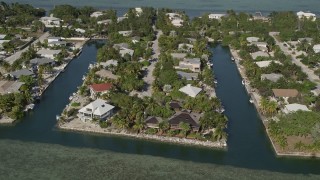 5K aerial stock footage of approaching homes on the island shore, Lower Sugarloaf Key, Florida Aerial Stock Footage | AX0027_050