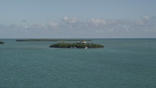 5K aerial stock footage of flying by small island with a home, Summerland Key, Florida Aerial Stock Footage | AX0027_066