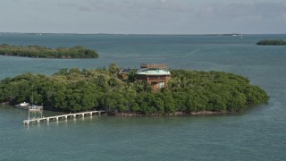 5K aerial stock footage of flying by small island with a home, Summerland Key, Florida Aerial Stock Footage | AX0027_067