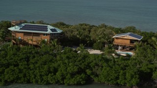 5K aerial stock footage of a small island with a home, Summerland Key, Florida Aerial Stock Footage | AX0027_068E