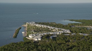 5K aerial stock footage of flying by Indigo Reef Vacation Rentals on the shore, Marathon, Florida Aerial Stock Footage | AX0028_002