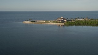 5K aerial stock footage of flying by the coast, near a mansion, Marathon, Florida Aerial Stock Footage | AX0028_003