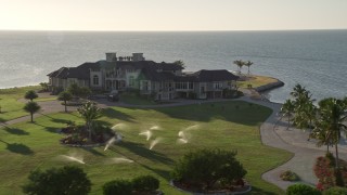 5K aerial stock footage of circling a mansion on the shore, Marathon, Florida Aerial Stock Footage | AX0028_006