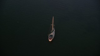 5K aerial stock footage of approaching sailboat at sunset, Key Largo, Florida Aerial Stock Footage | AX0028_035