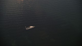 5K aerial stock footage of orbiting a sunken speedboat at sunset, Key Largo, Florida Aerial Stock Footage | AX0028_036