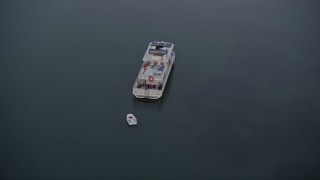 5K aerial stock footage of orbiting a houseboat near shore at sunset, Key Largo, Florida Aerial Stock Footage | AX0028_040