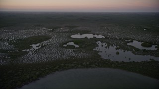 5K aerial stock footage fly over wetlands on the coast, Southern Glades, Florida, twilight Aerial Stock Footage | AX0028_049