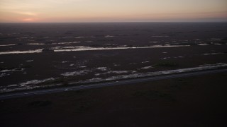 5K aerial stock footage of flying by South Dixie Highway, Southern Glades, Florida, twilight Aerial Stock Footage | AX0028_058