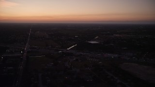 AX0028_062 - 5K aerial stock footage of flying by strip mall, Homestead, Florida, twilight