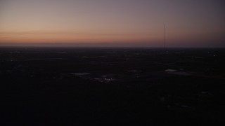 5K aerial  video of flying by Homestead, with coastline in distance, Homestead, Florida, twilight Aerial Stock Footage | AX0028_063