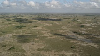 5K aerial stock footage of a wide view of the Florida Everglades, Florida Aerial Stock Footage | AX0030_055