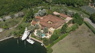 5K aerial stock footage of a mansion near canal, Coral Gables, Florida Aerial Stock Footage | AX0031_011