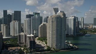 5K aerial stock footage of flying by Brickell Key, Downtown Miami skyscrapers, Miami, Florida Aerial Stock Footage | AX0031_025E