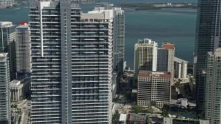 5K aerial stock footage of flying by Infinity at Brickell, revealing Espirito Santo Plaza, Downtown Miami, Florida Aerial Stock Footage | AX0031_032